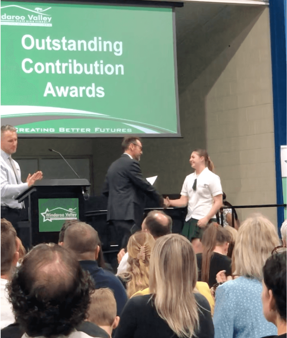 Lily receiving academic award